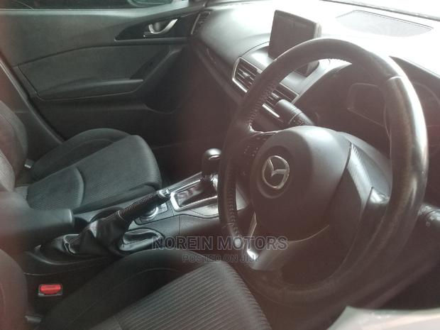 Red Mazda Axela 2015: High-Performance Compact Car