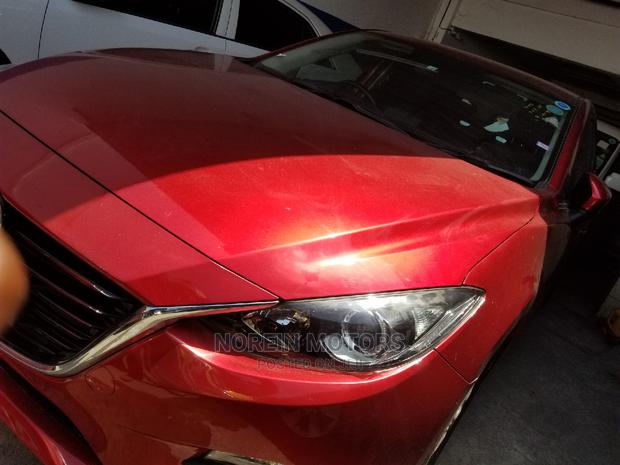 Red Mazda Axela 2015: High-Performance Compact Car
