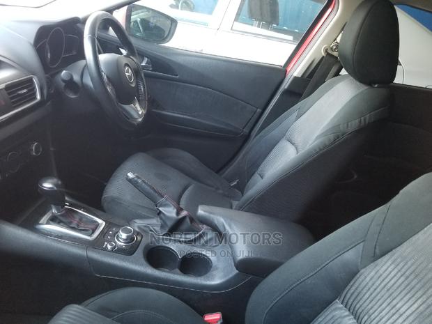 Red Mazda Axela 2015: High-Performance Compact Car