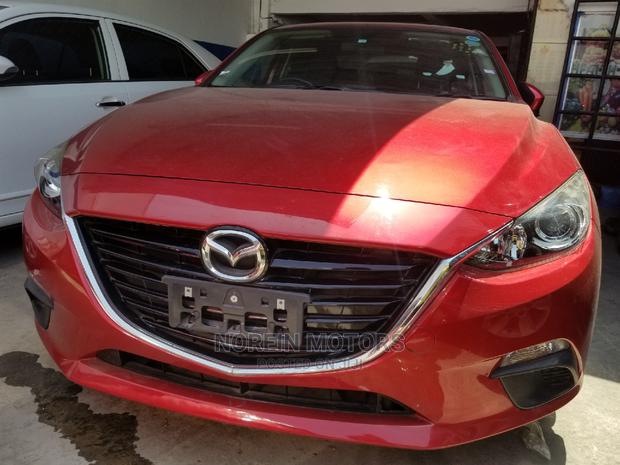 Red Mazda Axela 2015: High-Performance Compact Car