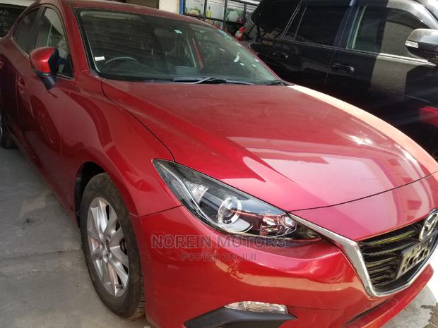 Red Mazda Axela 2015: High-Performance Compact Car