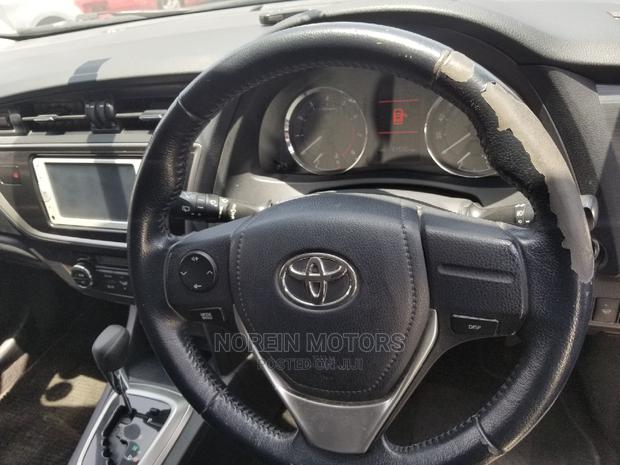 Used Toyota Auris 2015 White: Stylish and Efficient Compact Sedan
