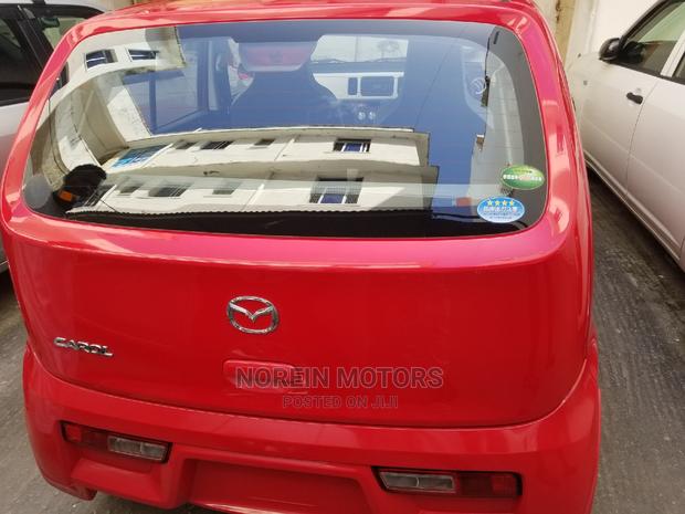 Red Mazda Carol 2014: Compact Car Excellence
