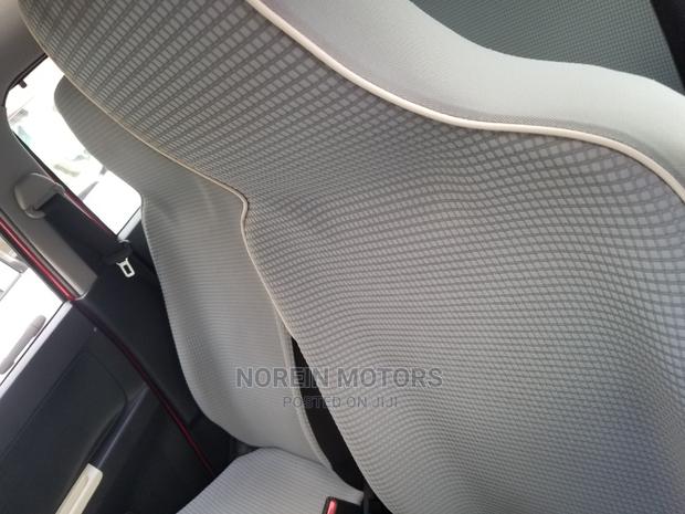 Red Mazda Carol 2014: Compact Car Excellence