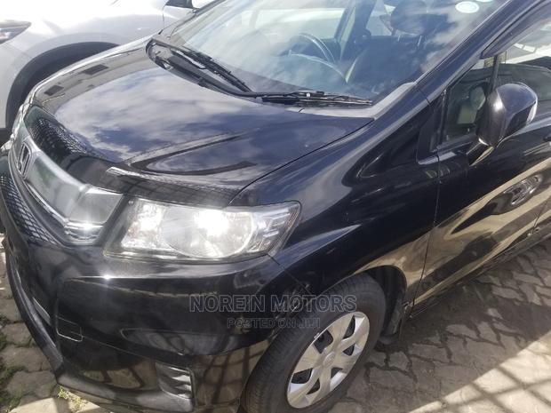 Black 2015 Honda Freed: Efficient and Practical MPV for Everyday Use