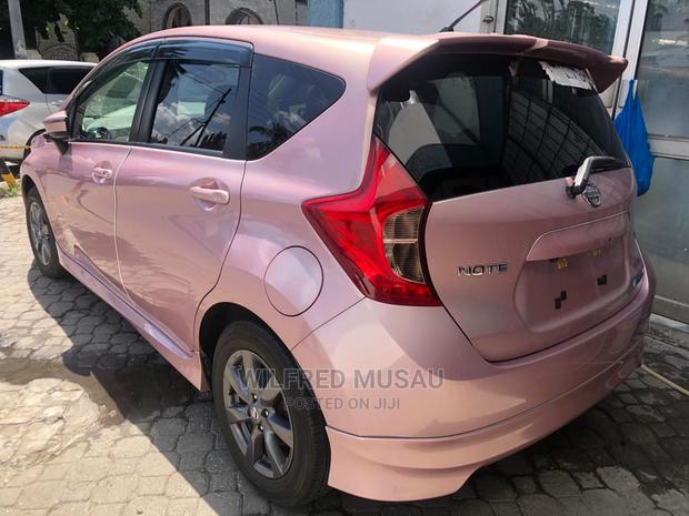 Pink Nissan Note 2015: Compact Car, Stylish, and Spacious