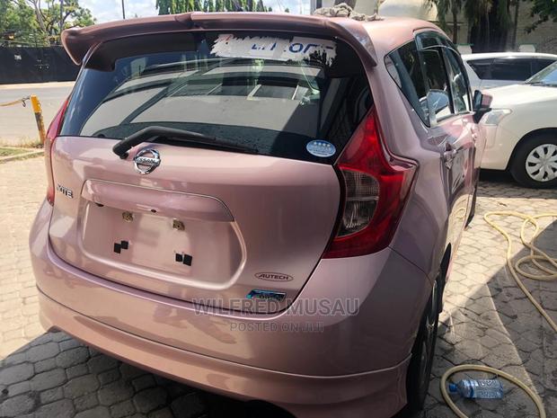 Pink Nissan Note 2015: Compact Car, Stylish, and Spacious