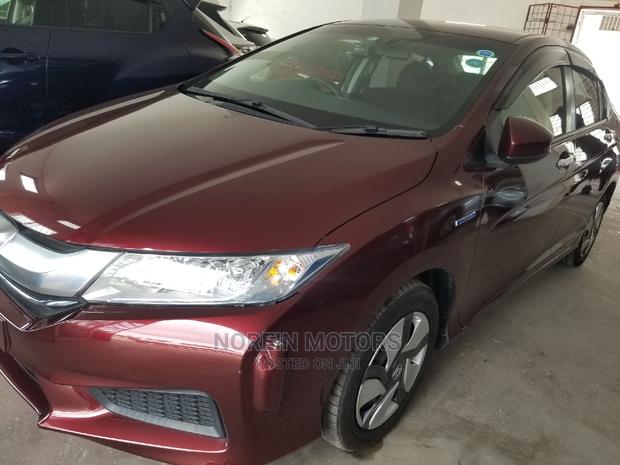 Honda Ballade 2015 in Red: Modern Sedan with Classic Appeal