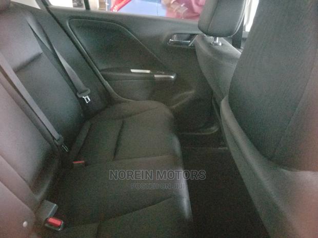 Honda Ballade 2015 in Red: Modern Sedan with Classic Appeal