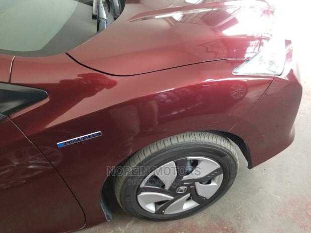 Honda Ballade 2015 in Red: Modern Sedan with Classic Appeal