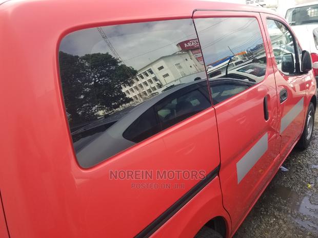 Orange Nissan NV200 SV 2015 - Pre-owned Cargo Van Listing