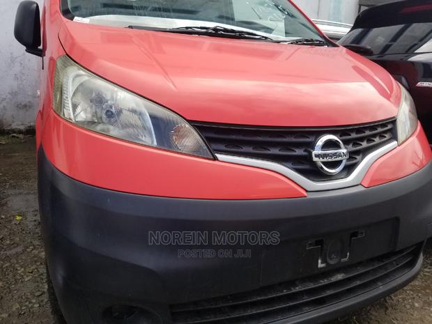 Orange Nissan NV200 SV 2015 - Pre-owned Cargo Van Listing
