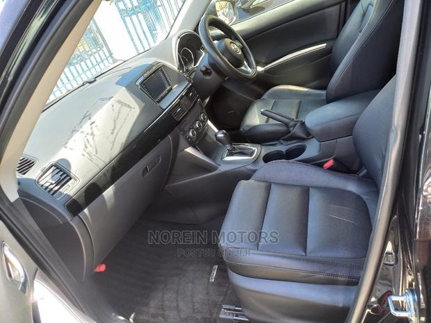 2015 Mazda CX-5 in Rich Burgundy: Modern Luxury SUV for Your Drive!