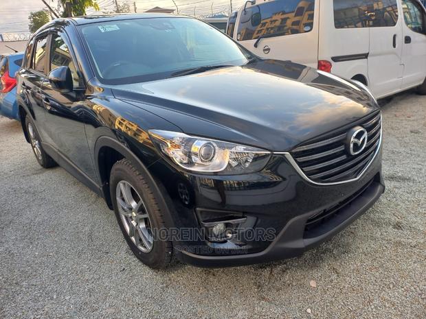 2015 Mazda CX-5 in Rich Burgundy: Modern Luxury SUV for Your Drive!