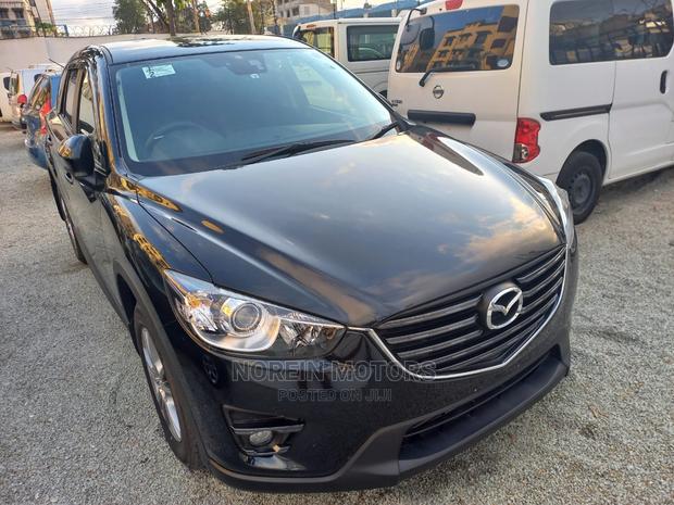 2015 Mazda CX-5 in Rich Burgundy: Modern Luxury SUV for Your Drive!