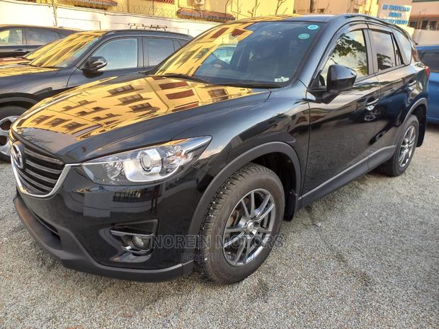 2015 Mazda CX-5 in Rich Burgundy: Modern Luxury SUV for Your Drive!