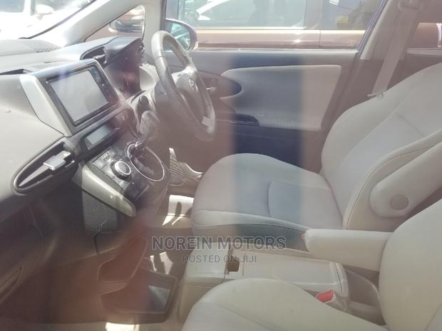 Blue 2014 Toyota Wish: Modern Comfort and Versatility