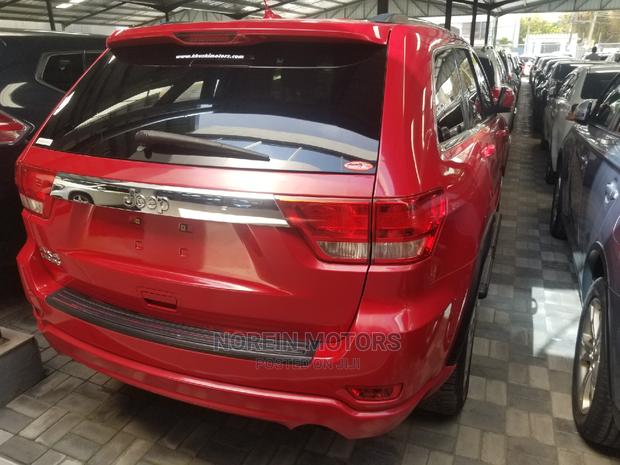 2014 Jeep Grand Cherokee in Red - Powerful & Stylish