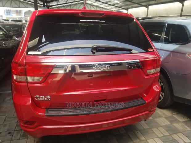 2014 Jeep Grand Cherokee in Red - Powerful & Stylish