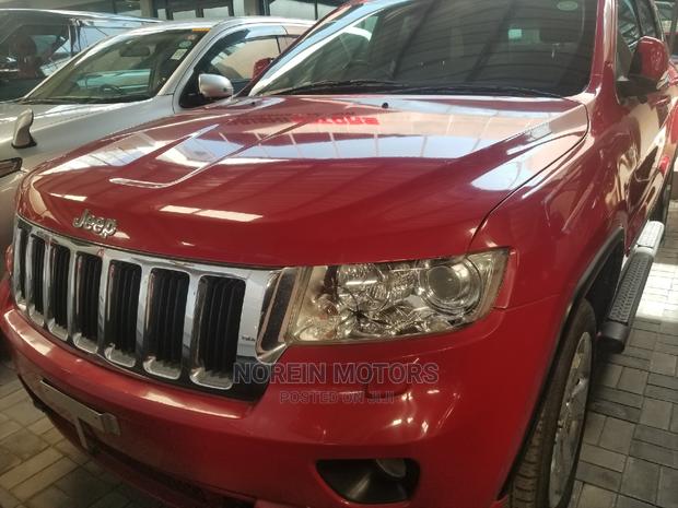 2014 Jeep Grand Cherokee in Red - Powerful & Stylish