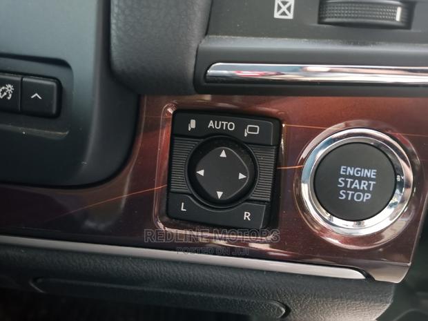 Red 2016 Toyota Crown: Modern, Comfortable Sedan with Power