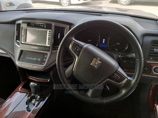 Red 2016 Toyota Crown: Modern, Comfortable Sedan with Power