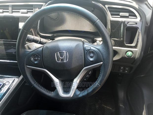 Blue 2016 Honda Fit 1.5 Hybrid: Affordable, Efficient Transportation