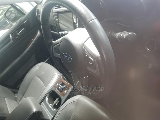 White 2015 Subaru Outback: Spacious SUV with 4WD Performance