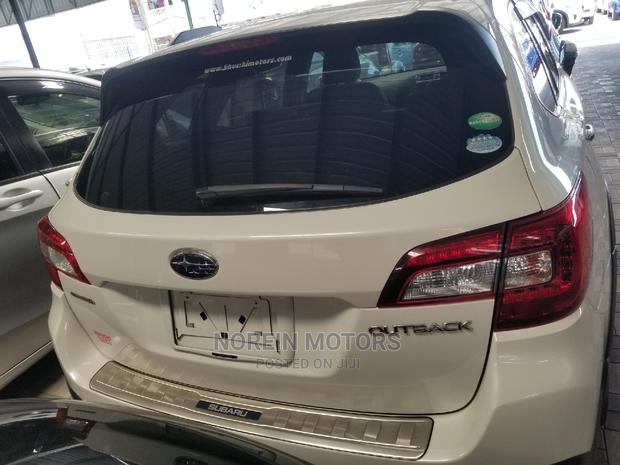 White 2015 Subaru Outback: Spacious SUV with 4WD Performance