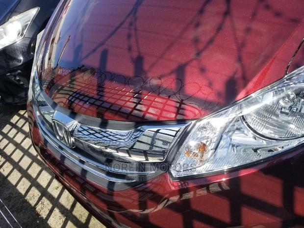 Red Honda Freed 2015: Efficient and Spacious Compact MPV
