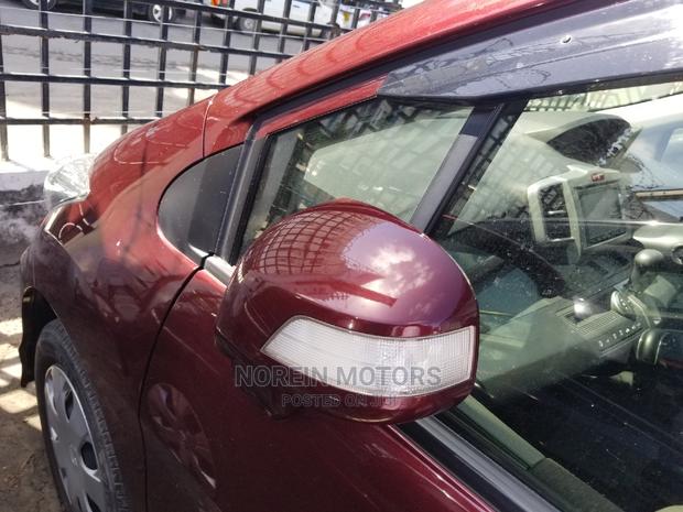 Red Honda Freed 2015: Efficient and Spacious Compact MPV
