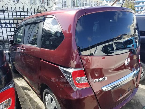 Red Honda Freed 2015: Efficient and Spacious Compact MPV