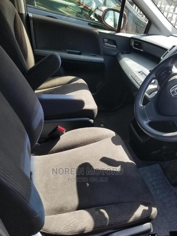 Red Honda Freed 2015: Efficient and Spacious Compact MPV
