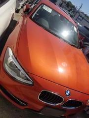 Orange 2015 BMW 116i: Luxury Compact Car with Style for sale