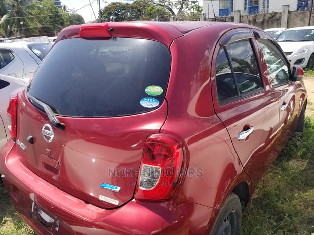 Red 2015 Nissan March: A Compact Car with Charm & Efficiency