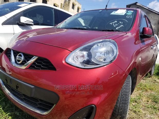 Red 2015 Nissan March: A Compact Car with Charm & Efficiency