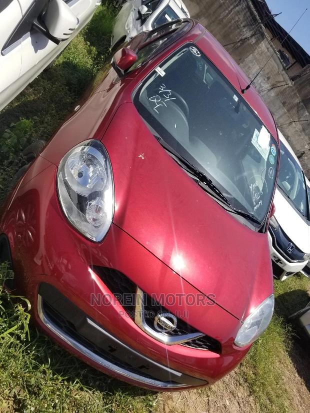 Red 2015 Nissan March: A Compact Car with Charm & Efficiency