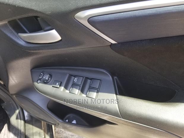 2015 Honda Fit Hybrid 4WD Black - Stylish, Spacious & Fuel-Efficient