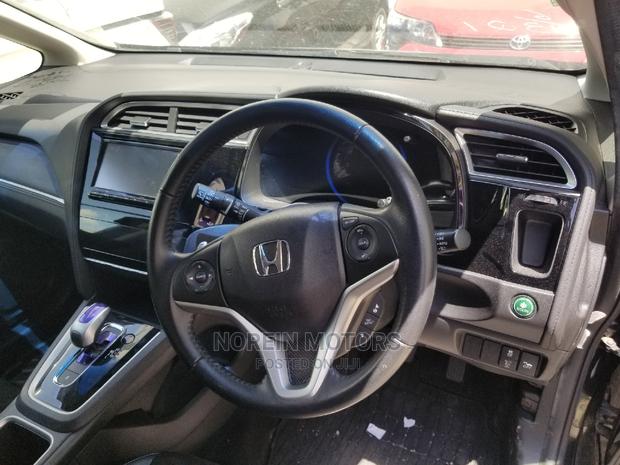 2015 Honda Fit Hybrid 4WD Black - Stylish, Spacious & Fuel-Efficient