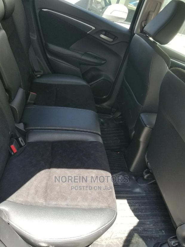 2015 Honda Fit Hybrid 4WD Black - Stylish, Spacious & Fuel-Efficient