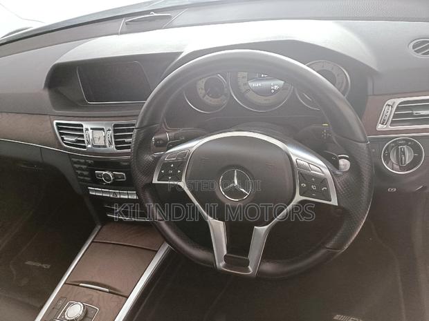 Pre-Owned 2015 Mercedes-Benz E250 in pristine white