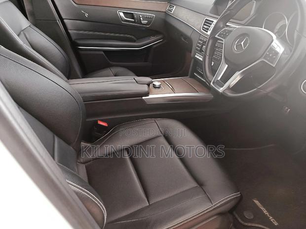 Pre-Owned 2015 Mercedes-Benz E250 in pristine white
