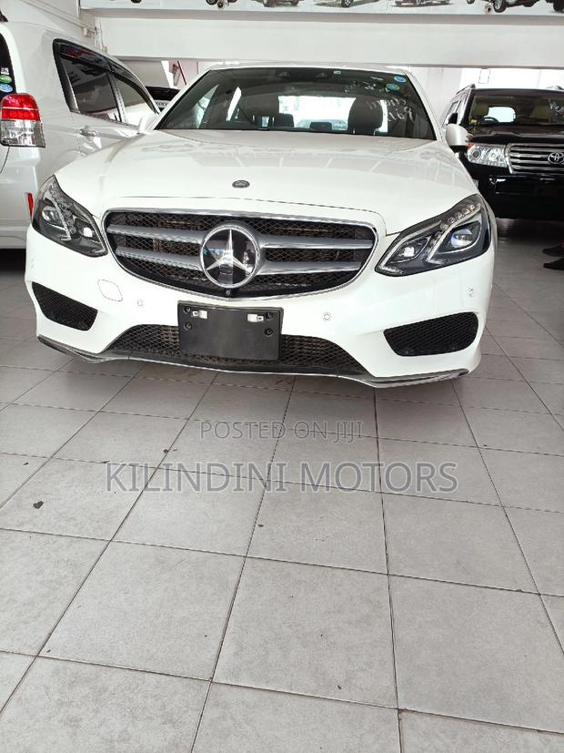 Pre-Owned 2015 Mercedes-Benz E250 in pristine white
