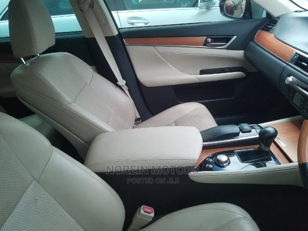 Luxury hybrid sedan with premium features and unparalleled performance, available in silver.