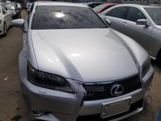 Luxury hybrid sedan with premium features and unparalleled performance, available in silver.