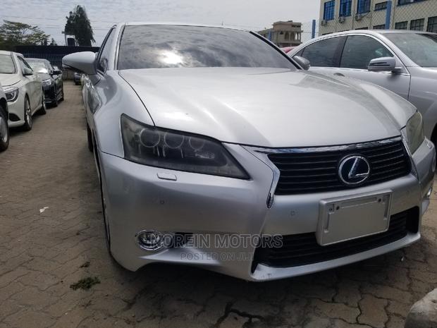 Luxury hybrid sedan with premium features and unparalleled performance, available in silver.