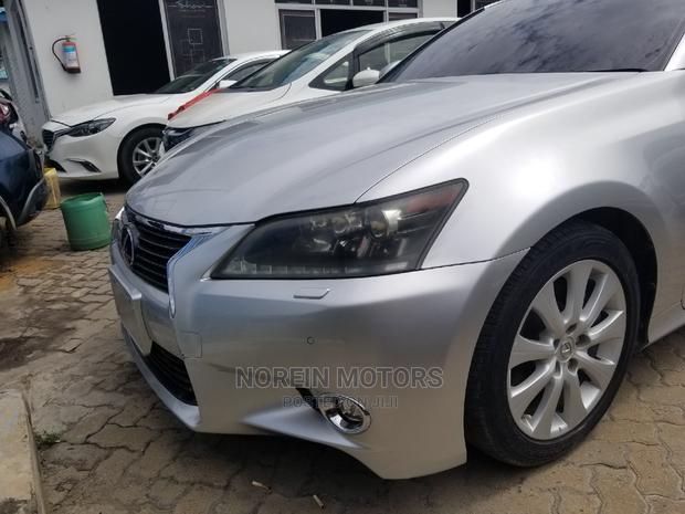 Luxury hybrid sedan with premium features and unparalleled performance, available in silver.