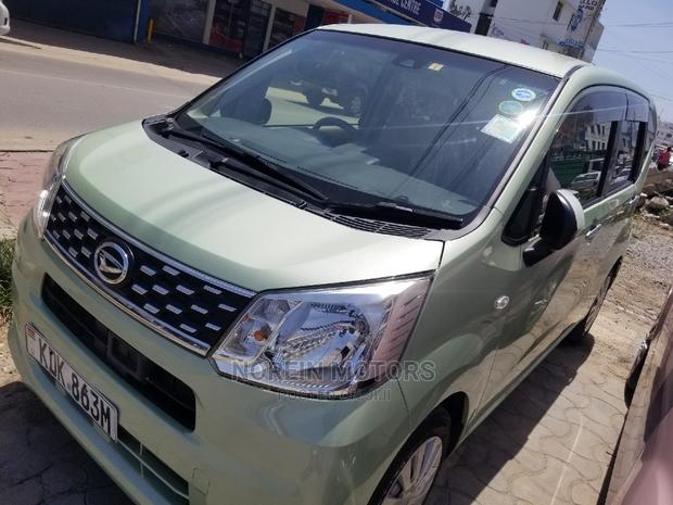 Eco-Conscious: 2015 Daihatsu Move Green - Compact, Efficient, and Stylish!