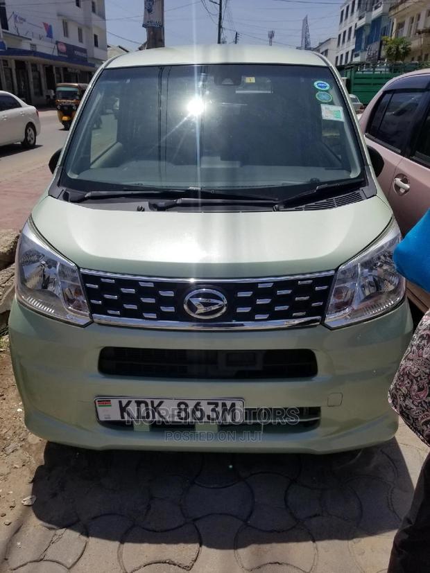 Eco-Conscious: 2015 Daihatsu Move Green - Compact, Efficient, and Stylish!