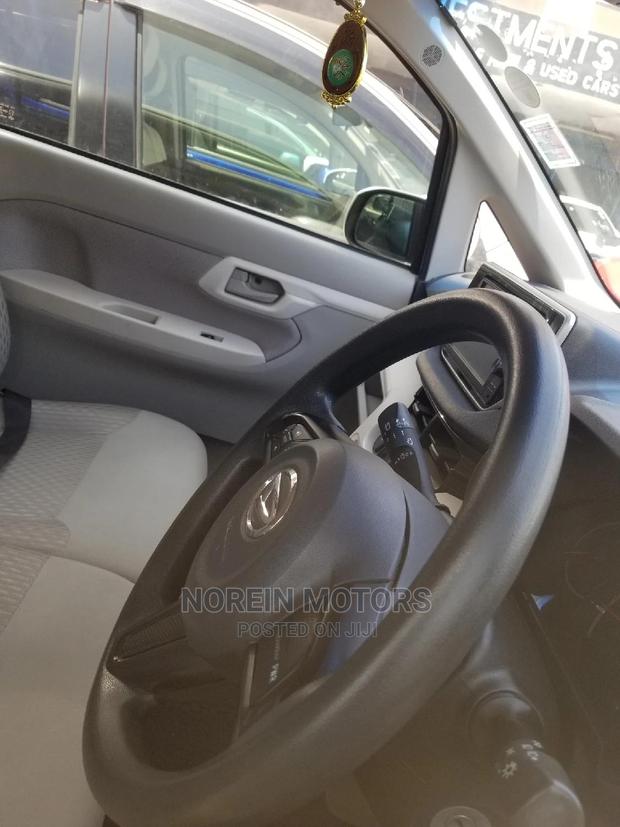 Eco-Conscious: 2015 Daihatsu Move Green - Compact, Efficient, and Stylish!